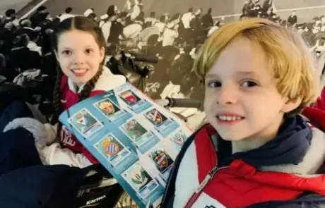 Carolina and her brother Juan Manuel at the C.D. Leganés stadium with the sticker album signed by the players.
