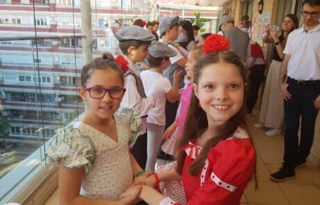 Chulapo dancing on the terrace during the San Isidro festival, with Carolina in a red dress.