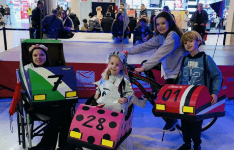 Carolina and her siblings in their bumper-car costumes at the contest they won.